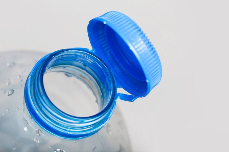 Close-up of the new cap on the connected plastic bottle tethered cap